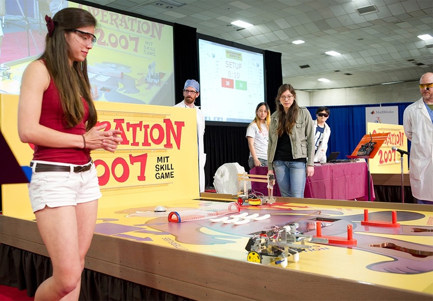 For the first time in the more than 40 years of the competition, the final matchup of the single-elimination tournament featured two women: Sophie Seidell, left, who finished second, and winner Aleksya Aguirre. During this initial period of the match, Seidell's robot is operating autonomously using preprogrammed commands, while Aguirre awaits the signal to pick up her remote control.