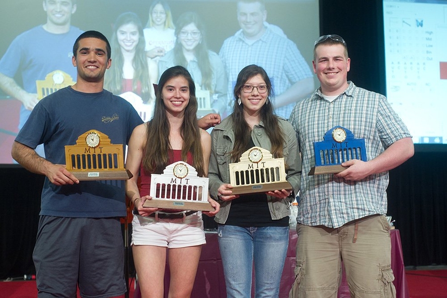 Trophy winners from the competition, from left, were Jose Smith, third place, Sophie Seidell, second place, Aleksya Aguirre, first place, and Matthew Hildner, fourth place. The trophies were made by staff of MIT's Pappalardo Lab.