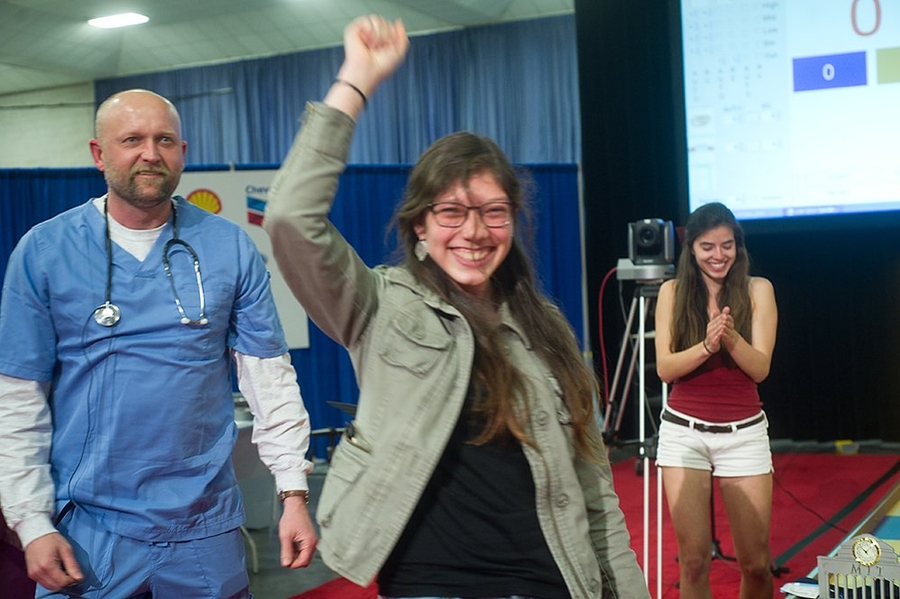Aguirre celebrates her victory, after being carried around the competition field on Frey's back in a traditional victory lap.