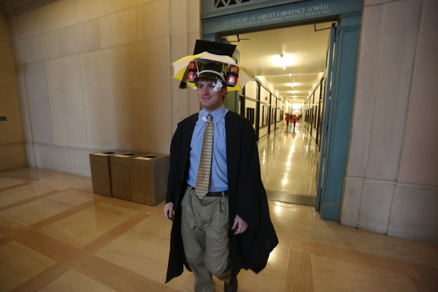 Creative headgear is a staple at MIT Commencements; here, a graduate found a way to stay dry and sustained.