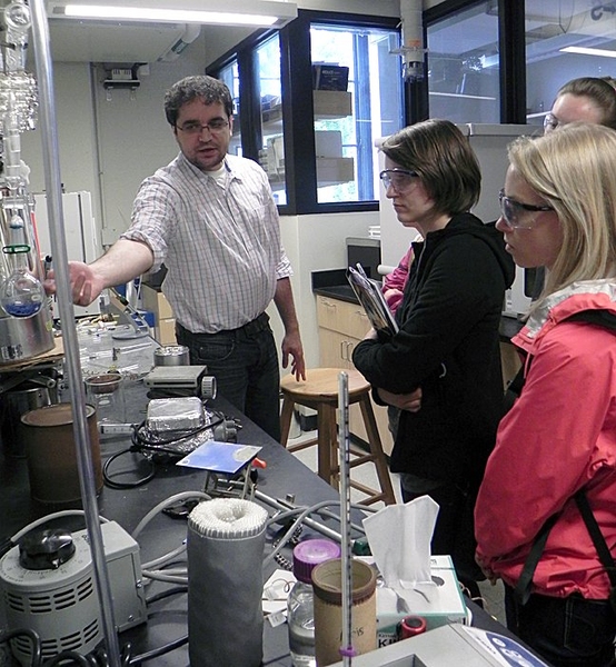 Chemistry Professor Mircea Dinca shows his lab to Summer Scholars exploring their areas of interest on the MIT campus.