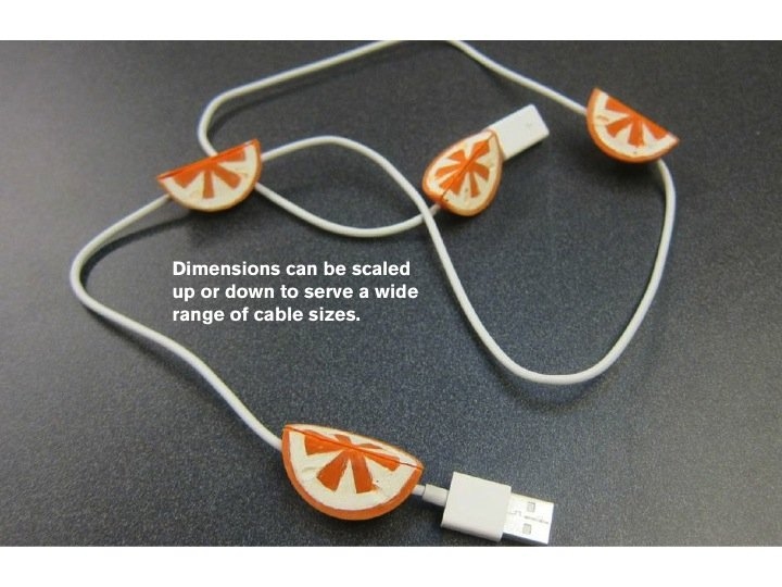 Keploc is a magnetic product in the shape of orange slices or other novelty items to keep otherwise disorganized cords separate and untangled. Team members include Vasilis Georgiadis, My Vu, Daniel Noday, Leon Faison, Eugene Minh, Daisy Sun, Janice Tan, and Vitor Silva.