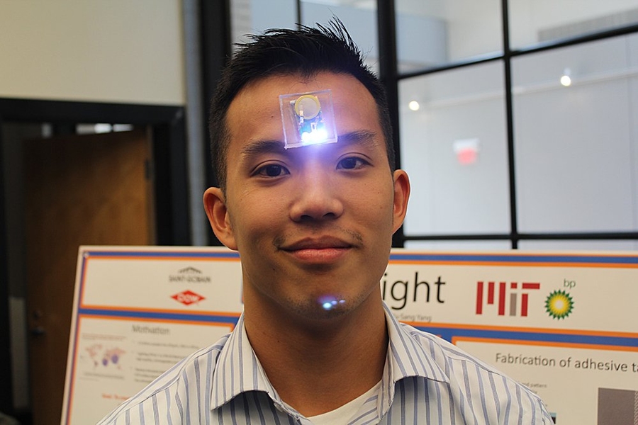 GeckoLight member Ritchie Chen demonstrates his team's lights that can stick to any surface, including skin.