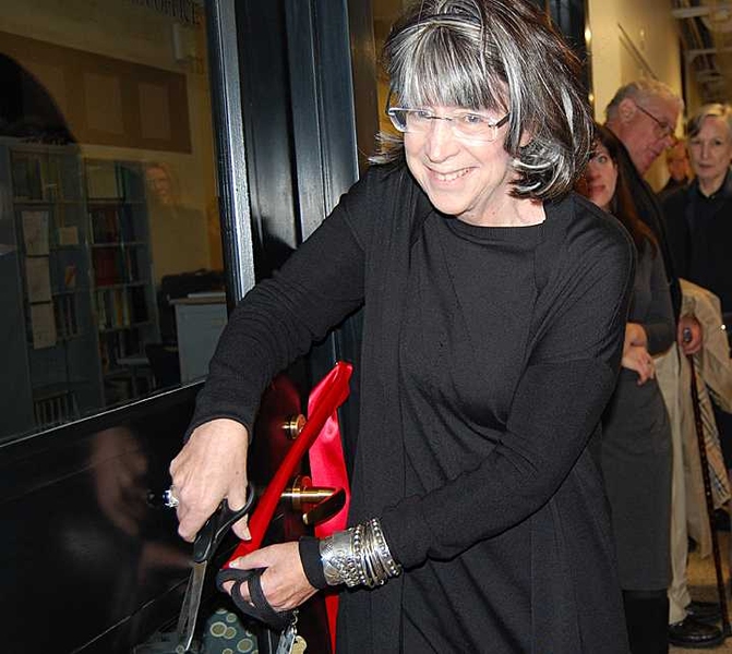 Susan Silbey, Leon and Anne Goldberg Professor of Sociology and Anthropology at MIT, cuts the ribbon to dedicate the Robert J. Silbey Chemistry Education Office.