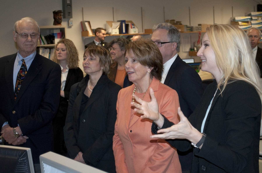 Congresswoman Nancy Pelosi observes data and images from the Alcator C-Mod tokamak on screens in the control room. Guided by Assistant Professor Anne White (right) she was joined by Vice President for Research Maria Zuber and PSFC Director Miklos Porkolab (front row). Also present (back row from right) were Alcator Project Head Earl Marmar, Principal Research Scientist Amanda Hubbard and Pelosi Ad...