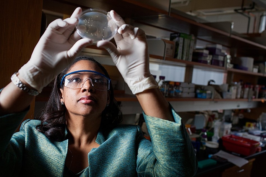 Prather examines yeast cells in her lab.