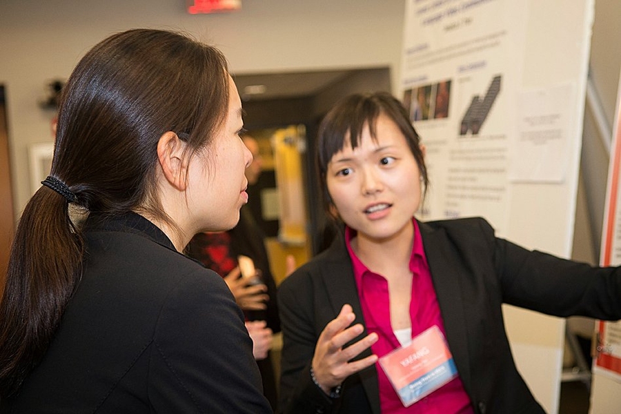 Caroline P. Lai (left), postdoctoral researcher with the Photonic Systems Group at the Tyndall National Institute in Ireland, learned about the research of fellow Rising Star Yafang Tan, PhD candidate in the Department of Electrical and Computer Engineering at the University of Illinois at Urbana-Champaign.