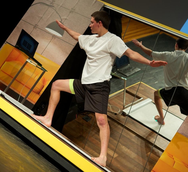 A yoga mat called Glow features built-in lights that tell the user where to place hands and feet, as well as pressure sensors to show how evenly the person's weight is distributed.