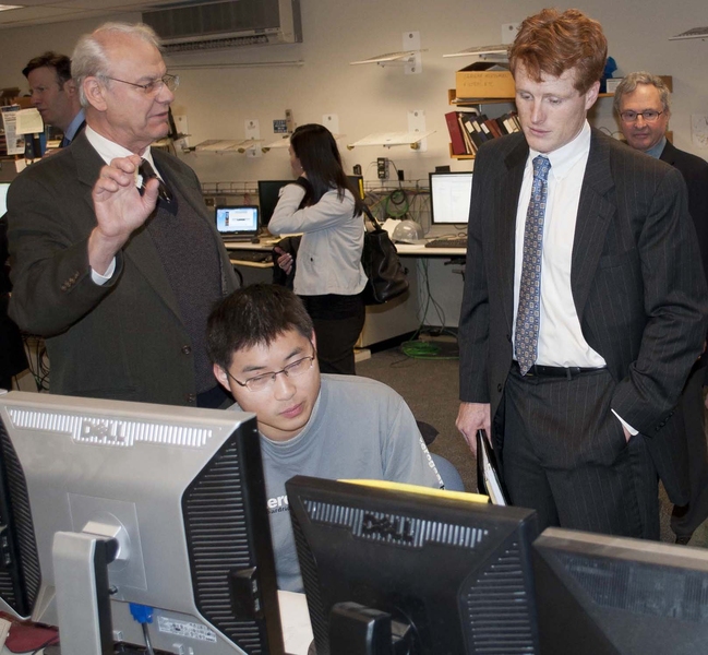 U.S. Rep. Joseph Kennedy III (right) observes data collected by graduate student Cornwall Lau as PSFC Director Miklos Porkolab explains the importance of student contributions to fusion research. In the background (right) is Earl Marmar, head of the Alcator Project.