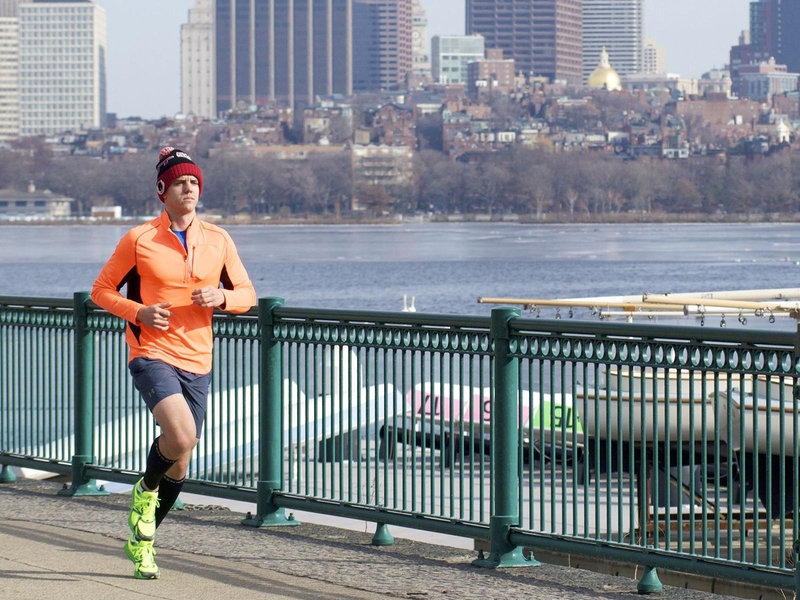 Graduate student Joseph Azzarelli running along the Charles River at MIT. Azzarelli's research involves sensors to detect explosives.