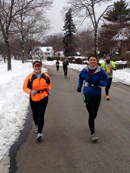 The local members of the team are training through a rough winter. Here, Stephanie Kloos (left), the fitness director at the Zesiger Center, and Sally Miller, an MIT sophomore, brave the cold and hit the hills on the marathon course on a February training run.