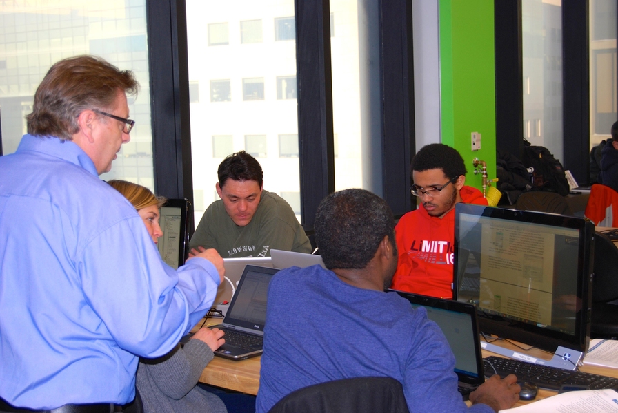 Cypress engineer Patrick Kane (left) introduced MIT students from across the campus to the new Programmable System on Chip (PSoC) in January 2014.