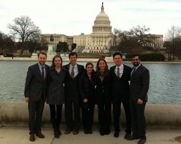 MIT's Better Buildings Case Competition team poses in front of the U.S. Capitol Building. From left to right: Brian Bowen, Julia Sokol, Philip Kreycik, Delphine Kaiser, Cheetiri Smith, Young Jin Kim, and Samir Luther. Not pictured: Akshay Dayal.