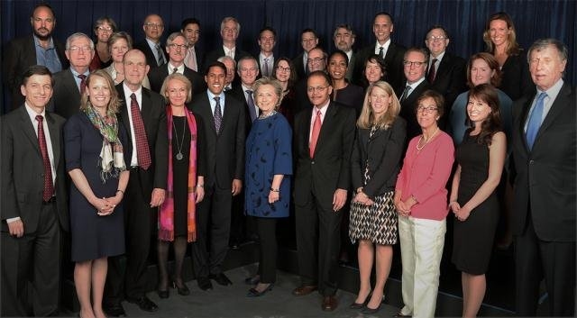 Rajiv Shah, head of USAID (front row, fifth from left), and former Secretary of State Hillary Clinton (at Shah's left) join representatives of the U.S. Global Development Lab Cornerstone Partners including MIT Vice President Claude Canizares (behind and left of Shah) and MIT D-Lab Founder and Co-Director Amy Smith (back row, second from left).