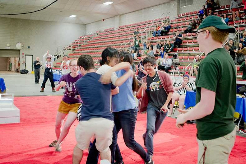 Friends of Clare Zhang rush onstage to celebrate her victory in the competition.