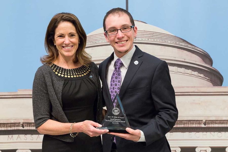 Chancellor Cynthia Barnhart presenting the John S.W. Kellett ’47 Award to Jordan Crouser of the Out Professional Employee Network (OPEN) at MIT Lincoln Laboratory.