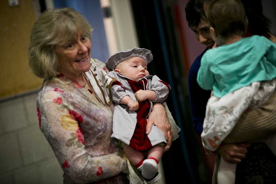 Three-month-old Colin Fucetola is held by Dottie Fucetola, who made her grandson's regalia. The two were guests of Colin's father, Corey Fucetola, a PhD candidate in electrical engineering.