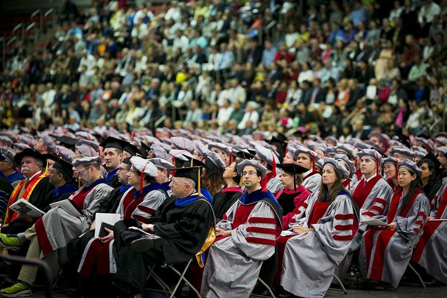 Members of the MIT faculty (foreground) and graduates' friends and families (background) turned out in large numbers for the hooding ceremony.