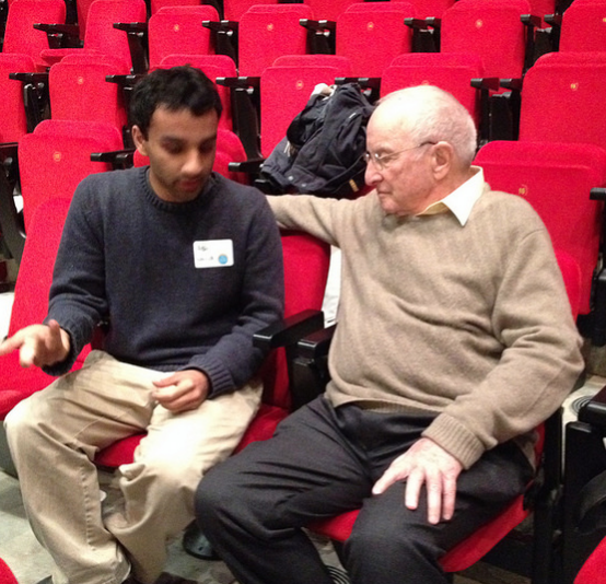 Paul Polak, author of "Out of Poverty" and "The Business Solution to Poverty," speaks with a student after the Scaling Development Ventures conference.
