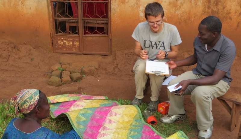 An MIT graduate student conducts field interviews in Uganda as part of an evaluation of solar lantern technologies.