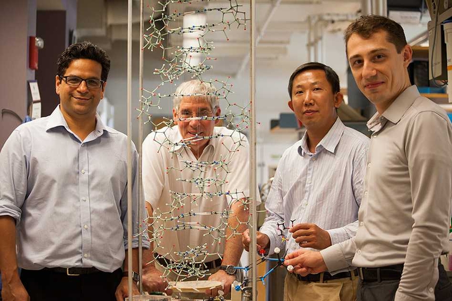 Scientists in the Essigmann lab — (left to right) Vipender Singh, John Essigmann, Deyu Li, and Bogdan Fedeles — scrutinize the structure of the DNA double helix, as they investigate the mechanism of mutagenesis of KP1212.