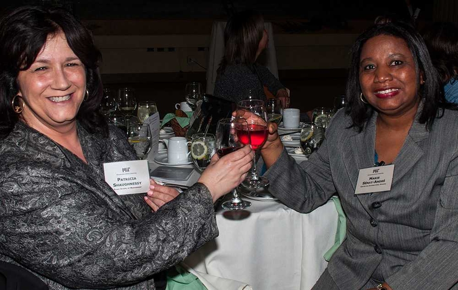 Patricia Shaughnessy of the Sloan School of Management and Marie Sénat-André of the Center for International Studies toast 25 years at the Institute.