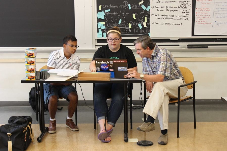 Physics instructors Tahmid Rahman, a STEM Program alum, and Hollie O’Brien review curriculum plans with veteran teacher Mike Craig. Tahmid and Hollie’s level-two students, who will enter seventh grade in the fall, also studied chemistry.