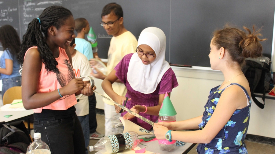 In their level-two physics course, Doralee Heurtelou, Sitnour Elamin, and Evelyn Reyes build rockets out of plastic bottles and duct tape.