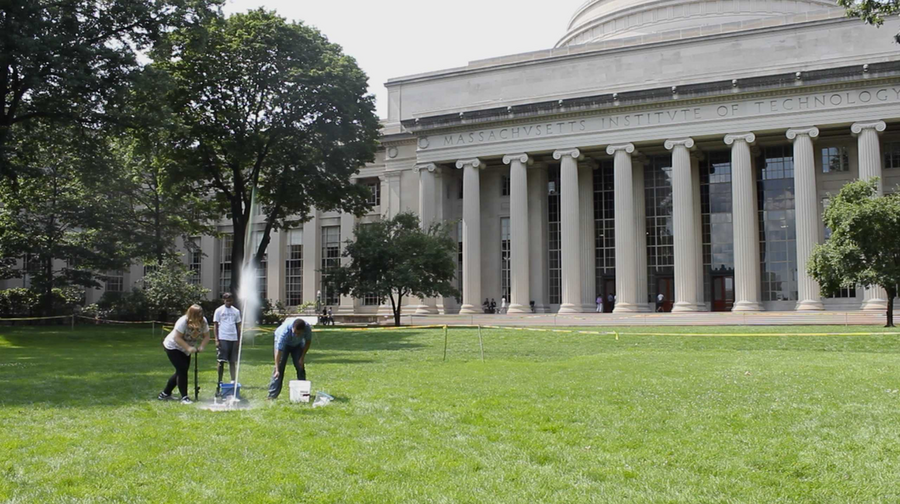 Instructors Holly O’Brien, Tahmid Rahman, and Matt Okabue launch their students’ bottle rockets from Killian Court in front of MIT’s iconic Great Dome.