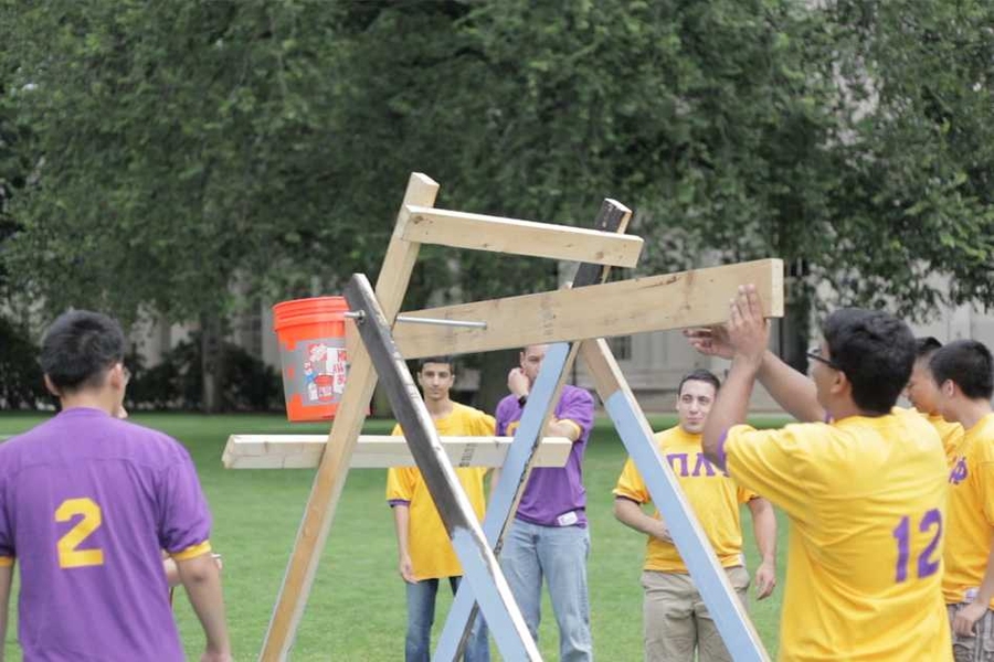 Pi Lambda Phi created a catapult for the Ice bucket challenge, which soaked President Reif a second time.