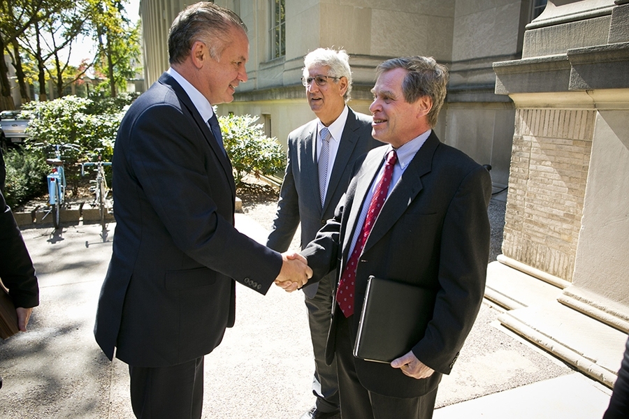 Andrej Kiska, president of Slovakia, left, shakes hands with Bernd Widdig, MIT's director of international affairs, as Philip Khoury, the Ford International Professor of History and associate provost, looks on.