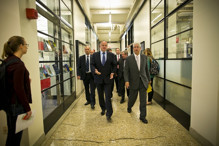 Andrej Kiska, president of Slovakia, front left, walks down the Infinite Corridor with Associate Provost Philip Khoury, the Ford International Professor of History.