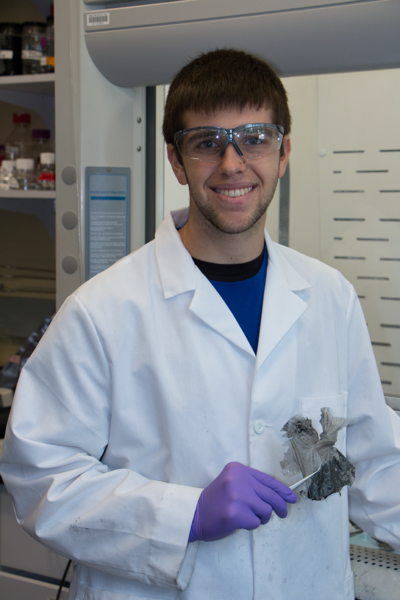 Eric Bailey holds a composite hydrogel composed of carbon nanotubes embedded in a polymer. “We’d like it to be a network of carbon nanotubes, so that gives it conductivity,” Bailey says.