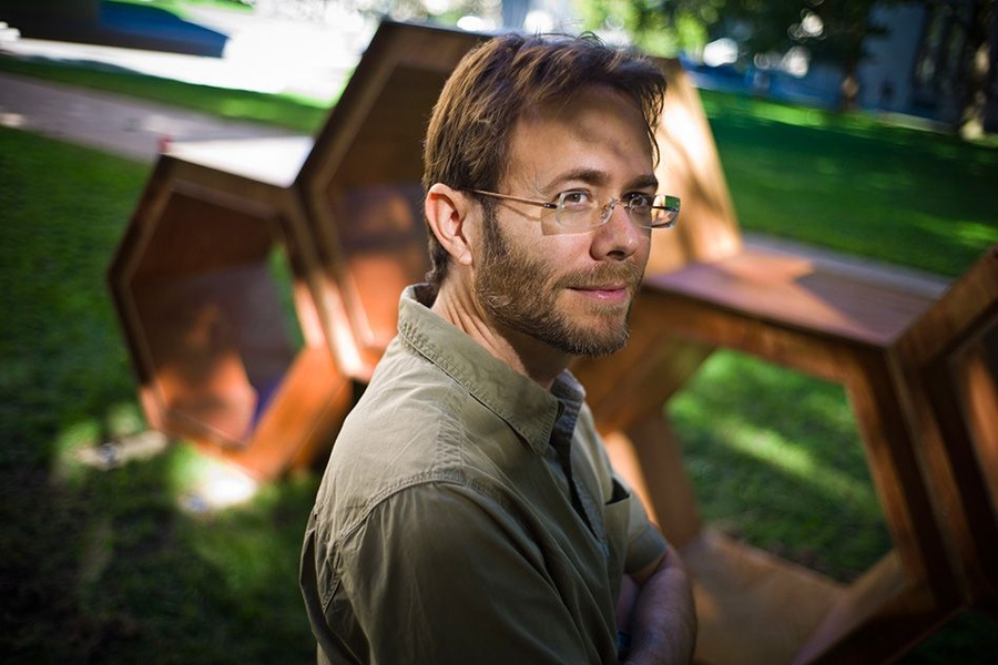 MIT associate professor of philosophy Brad Skow, in front of “The Hexagons,” a sculpture on the MIT campus by Tara Ebsworth ’14. The sculpture was funded by the Council for the Arts at MIT and the MIT Art Scholars program.