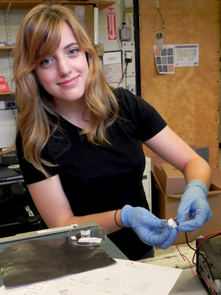 Meredith Fields holds a self-folding origami-inspired laminates whose hinge-folding action is triggered by electricity. The millimeter to centimeter scale laminates have a potential to be used in batteries.