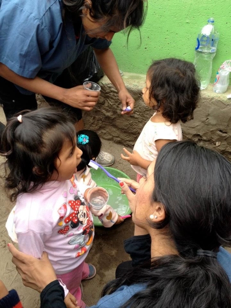 Lalani taught children how to use a toothbrushi while in Peru.