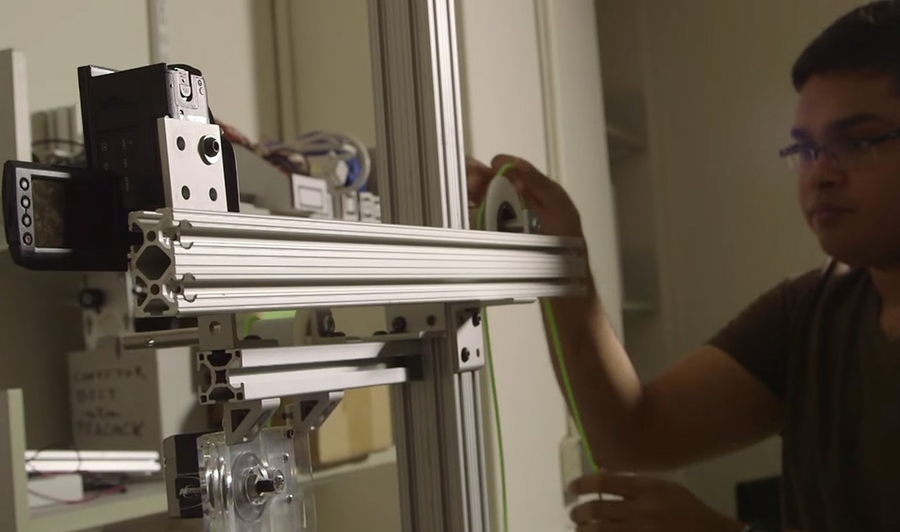 Khalid Jawed, a PhD student in mechanical engineering, experiments with a thin polymeric rod.