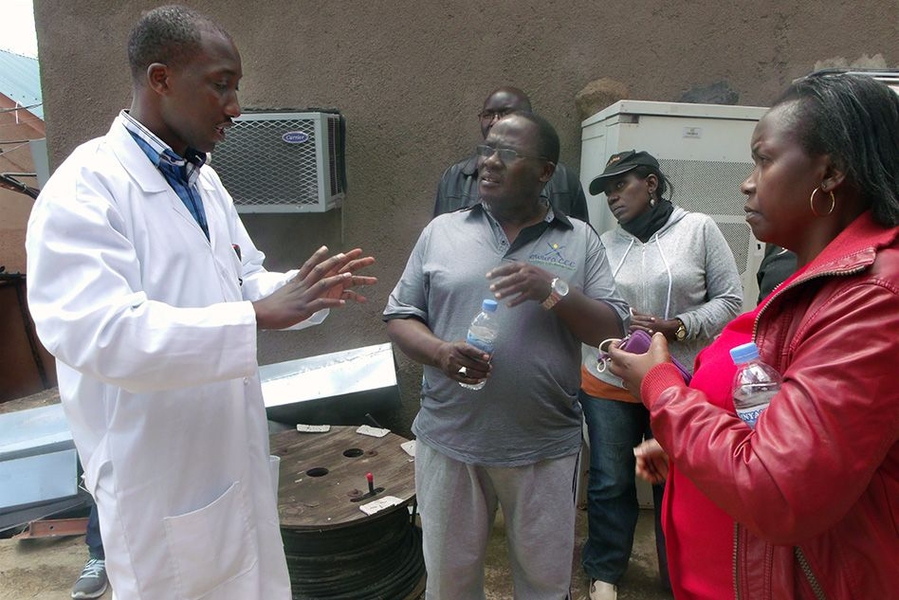 Gasore gives a tour of the Rwanda Climate Observatory to scientists from East Africa and the European Union.