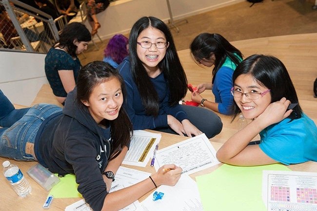 Math Prize participants work together on a puzzle hunt at Microsoft's game night.