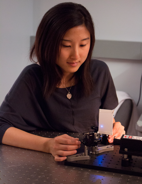 Chi "Alice" Lu in the laser lab, where she tests her flexible polymer probe.