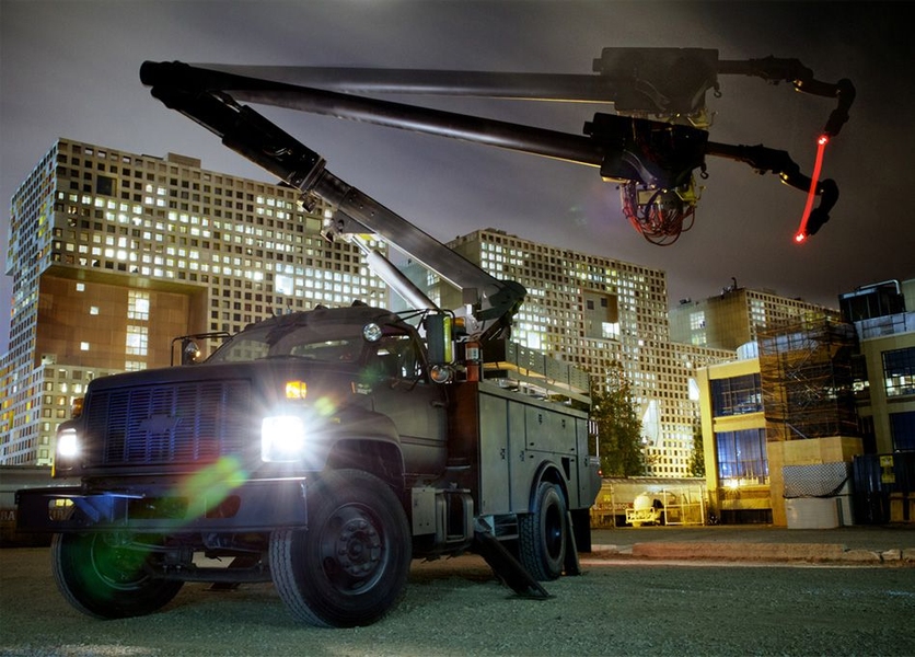 A Digital Construction Platform consists of a boom truck system repurposed for the 3D-printing of buildings.