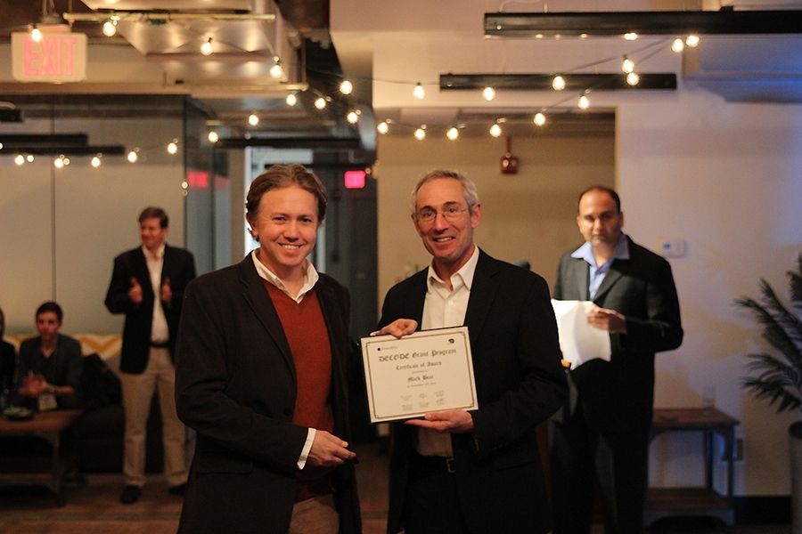Jeffrey Gavornik of the Bear Lab at MIT receives Mark Bear's DECODE Award from guest of honor Thomas Insel.