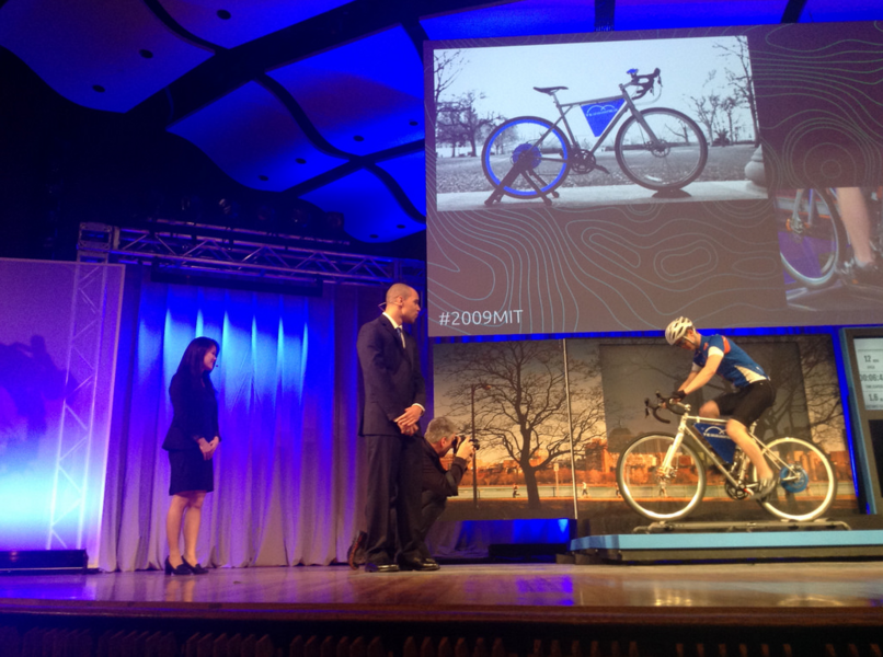 Terrainer, demonstrated by the blue team, converts a regular bicycle into a training bike by adding extra resistance to the wheels, displaying the cyclist’s level of exertion just as a stationary bicycle would in a gym.