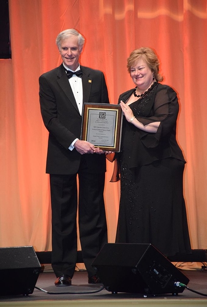 Don Boroson, laboratory fellow in the Communication Systems Division at MIT Lincoln Laboratory, and Catherine Barclay, a deputy program manager at the NASA Goddard Space Flight Center, accept the Editor's Choice Award plaque on behalf of the Lunar Laser Communication System (LLCS) and Lunar Laser Communication Demonstration (LLCD) teams. Boroson, along with Bryan Robinson, Dennis Burianek, Daniel ...