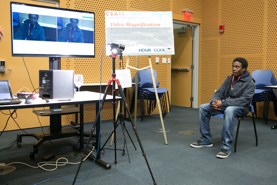 A student watches video of himself that has been put through Neal Wadhwa's magnification software.