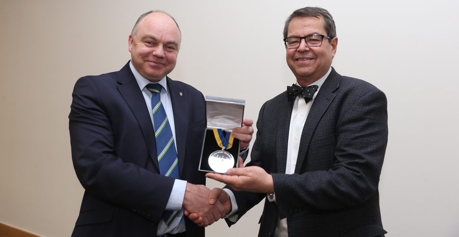 Professor Andrew J. Deeks (left), president of University College Dublin, presents MIT Professor Stephen L. Buchwald with the Ulysses Medal.
