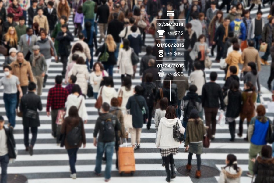 crowd of people crossing a street at a crosswalk
