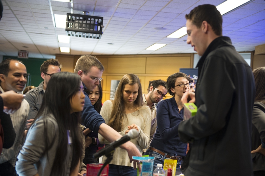 Kris Bronner, co-creator of UNREAL Brands, shares his product (natural candy) with an avid group following the panel on marketing techniques.