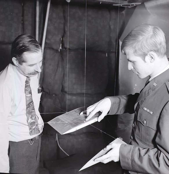 Professor Eugene Covert discusses graduate student advisee U.S. Air Force Lt. John Keesee’s wind tunnel research in 1974.