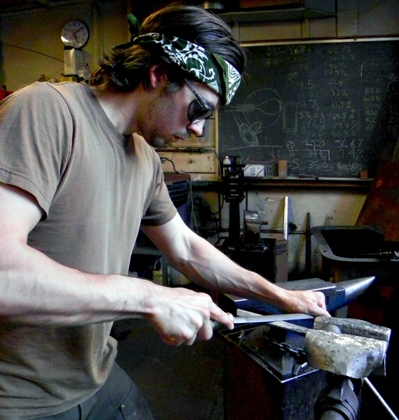 James Hunter files a metal blade for a wood splitting tool, known as a froe, in the MIT Glass Lab and Forge. The newly established Lemelson-Vest Fund will support hands-on experiences for MIT undergraduate and graduate students in the Institute’s Glass Lab, Foundry, Forge, and other fabrication facilities within the Department of Materials Science and Engineering (DMSE).